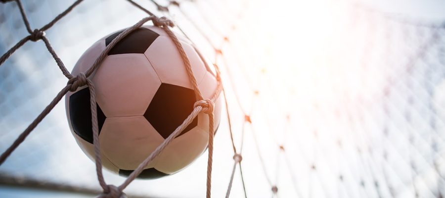 Soccer into goal success concept