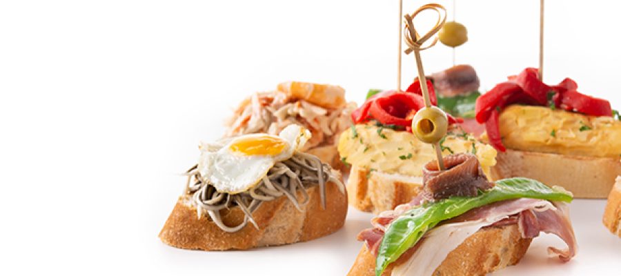 Assortment of Spanish pintxos isolated on white background
