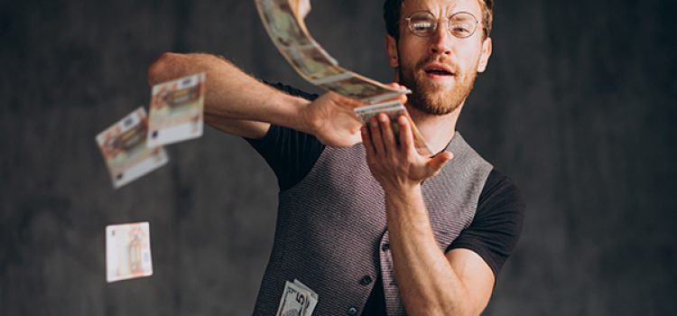 Man with banknotes isolated in studio