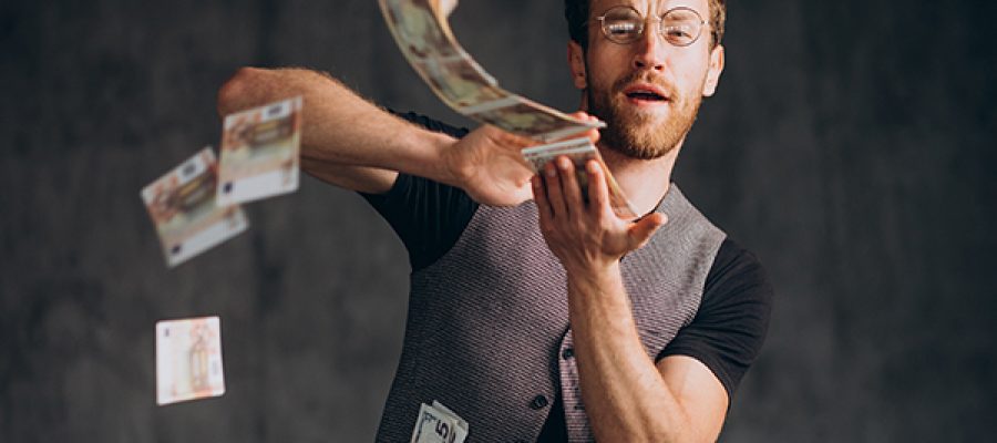 Man with banknotes isolated in studio